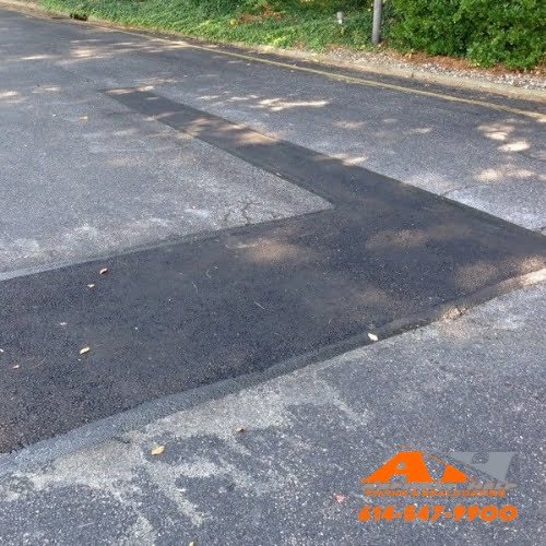 Asphalt repiars in Arlington, OH A person doing residential driveway paving in Powell, OH