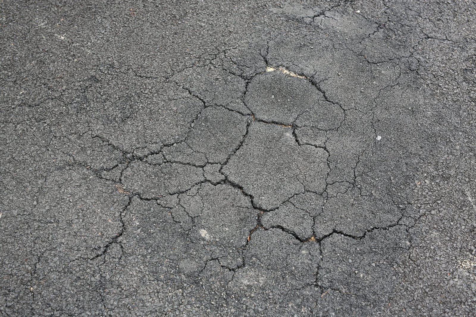 Cracked Asphalt Background.